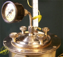 Cover the tank with pressure gauge and thermometer
